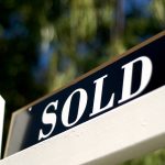 sold sign in front of house or condo